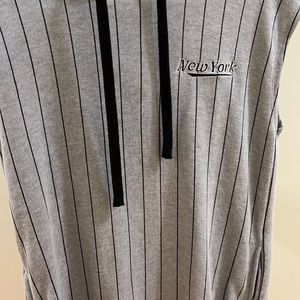 Grey striped sleeveless sporty hooded dress.